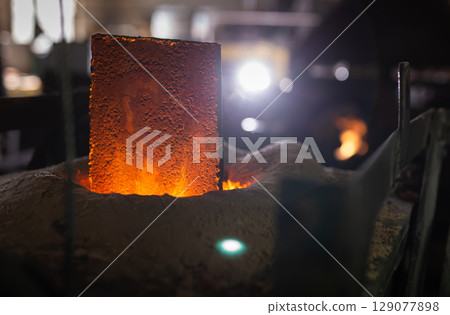 Foundry - ferrous metal is melted in an induction furnace of metallurgical plant Foundry - ferrous metal is melted in an induction furnace of metallurgical plant 129077898