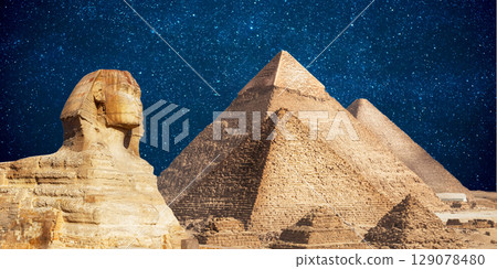 night scene of the castle pyramid in the desert 129078480