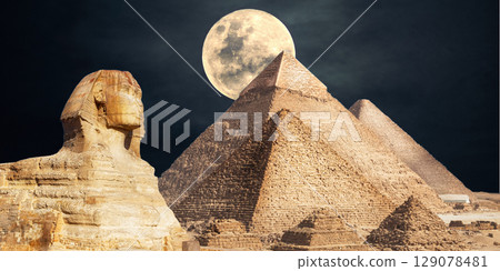 night scene of the castle pyramid in the desert 129078481