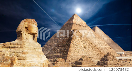 night scene of the castle pyramid in the desert 129078482