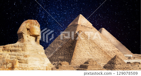 night scene of the castle pyramid in the desert 129078509