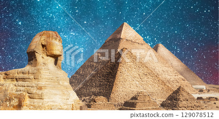 night scene of the castle pyramid in the desert 129078512