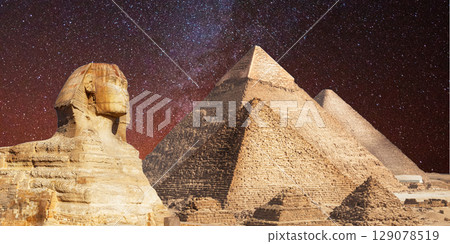 night scene of the castle pyramid in the desert 129078519