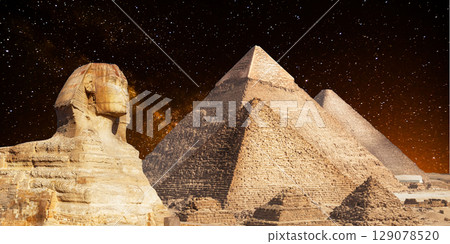 night scene of the castle pyramid in the desert 129078520