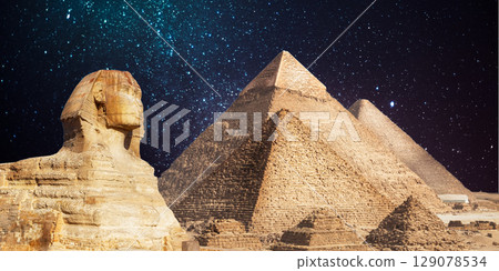 night scene of the castle pyramid in the desert 129078534
