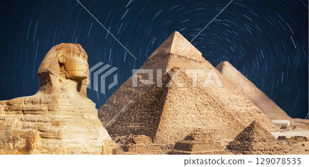 night scene of the castle pyramid in the desert 129078535