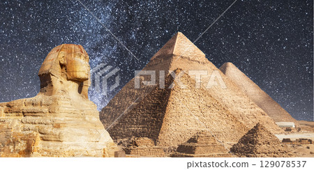 night scene of the castle pyramid in the desert 129078537
