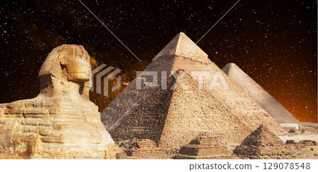 night scene of the castle pyramid in the desert 129078548