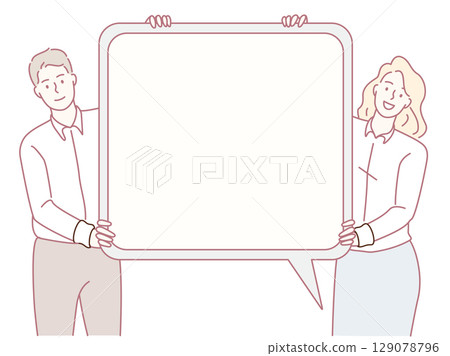 A couple is playfully holding an empty speech bubble, representing open communication and dialogue 129078796