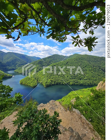 Piatra lui Lucaci hiking trail view over Tarnita Lake. Cluj, Romania 129079013