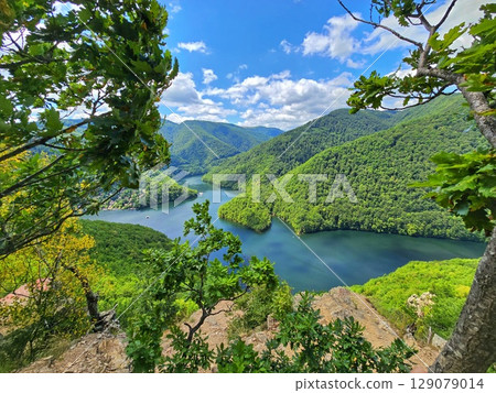 Piatra lui Lucaci hiking trail view over Tarnita Lake. Cluj, Romania 129079014