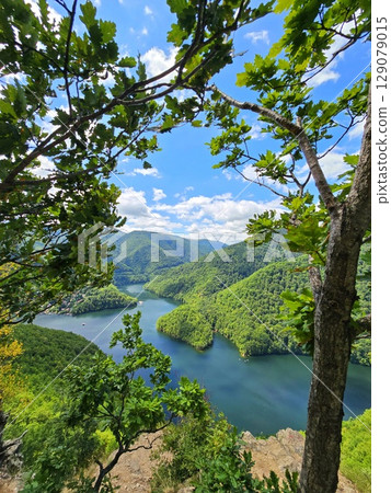 Piatra lui Lucaci hiking trail view over Tarnita Lake. Cluj, Romania 129079015
