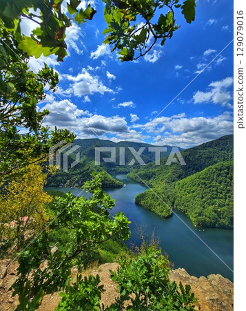 Piatra lui Lucaci hiking trail view over Tarnita Lake. Cluj, Romania 129079016