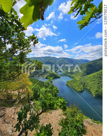 Piatra lui Lucaci hiking trail view over Tarnita Lake. Cluj, Romania 129079017