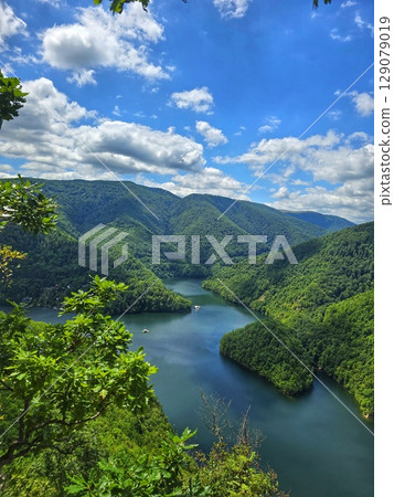 Piatra lui Lucaci hiking trail view over Tarnita Lake. Cluj, Romania 129079019