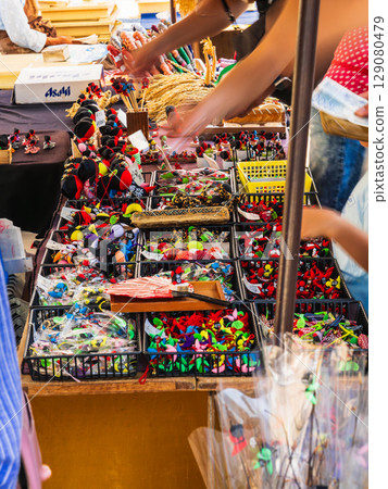 Miyagawa Morning Market: Tourists purchasing Hida dolls "Sarubobo" 129080479