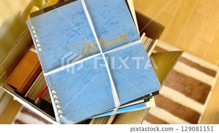 Aerial view of multiple albums tied with string 129081151