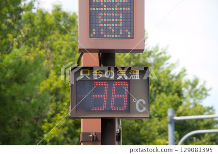 A roadside sign indicating a temperature of 38 degrees A roadside sign indicating a temperature of 38 degrees 129081395