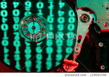 moving hard drive head with green data on drive moving hard drive head with green data on drive 129081546