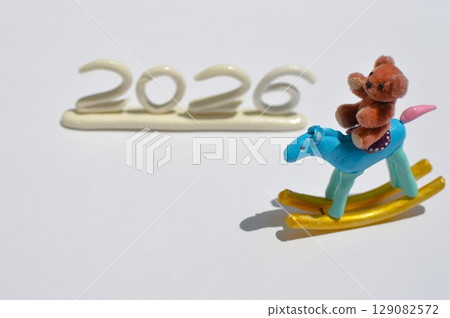 Paper clay rocking horse and teddy bear New Year's materials 129082572