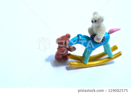 Paper clay rocking horse and teddy bear New Year's materials 129082575