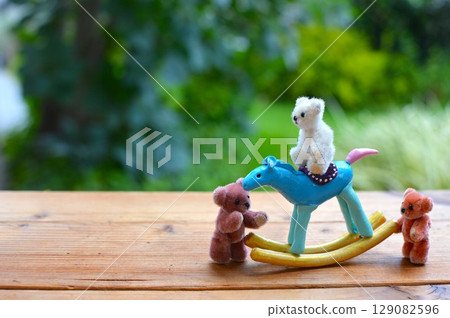 Paper clay rocking horse and teddy bear New Year's materials Paper clay rocking horse and teddy bear New Year's materials 129082596