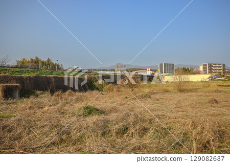 March 25 2025 Peaceful Urban Landscape with a River and Surrounding Architecture, Japan 129082687