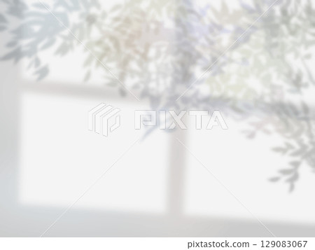 Background material with the shadows of windows and trees reflected on the wall 129083067