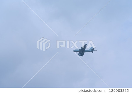 Air Self-Defense Force C-2 transport aircraft flying through cloudy skies Air Self-Defense Force C-2 transport aircraft flying through cloudy skies 129083225