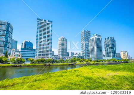 Yokohama cityscape in Japan. View of tower apartment buildings on the riverside of Yokohama. Yokohama cityscape in Japan. View of tower apartment buildings on the riverside of Yokohama. 129083319
