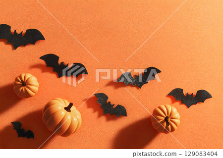 Clean Halloween background with spooky shadows and open space, perfect for design templates, ads, or social posts. 129083404