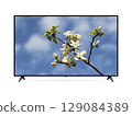 Smart tv with a blooming branch of apple tree on screen 129084389