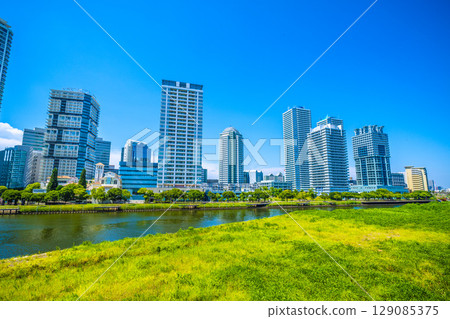 Yokohama cityscape in Japan. View of tower apartment buildings on the riverside of Yokohama. Yokohama cityscape in Japan. View of tower apartment buildings on the riverside of Yokohama. 129085375