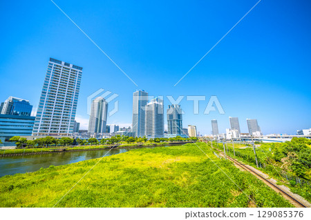 Yokohama cityscape in Japan. View of tower apartment buildings on the riverside of Yokohama. Yokohama cityscape in Japan. View of tower apartment buildings on the riverside of Yokohama. 129085376