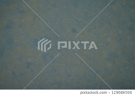 Worn blue surface with dust and grunge texture 129086508
