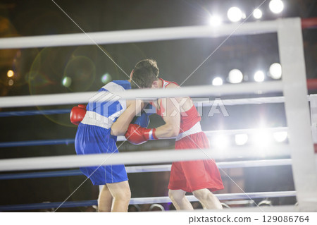 boxers fight with gloves in the ring punch hook boxers fight with gloves in the ring punch hook 129086764