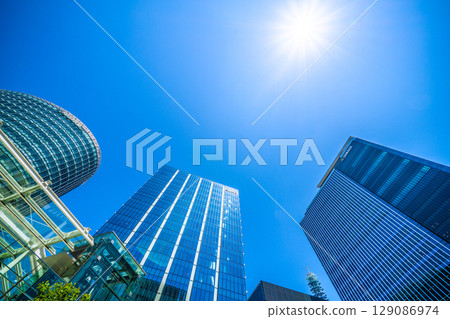Yokohama cityscape in July. Overlooking the business district in front of Shin-Takashima Station. 129086974