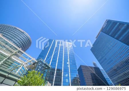 Yokohama cityscape in July. Overlooking the business district in front of Shin-Takashima Station. 129086975