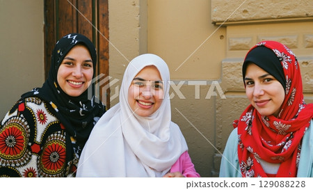 Confident women proudly wear headscarves, embracing cultural identity with warm smiles and graceful dignity 129088228