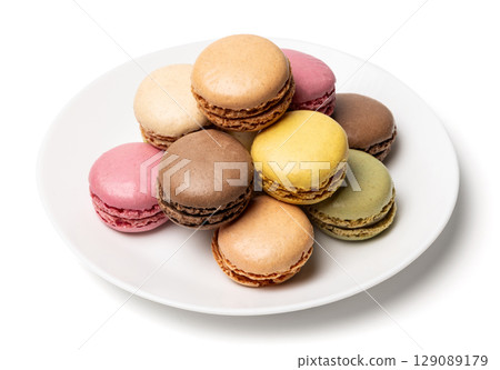 Small tasty sweet original classic macaroons cakes on plate isolated on white studio background 129089179