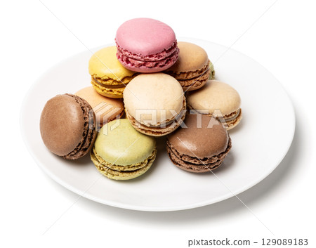 Small tasty sweet original classic macaroons cakes on plate isolated on white studio background 129089183