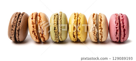 Small colorful tasty sweet original classic macaroons cakes isolated on white studio background 129089193