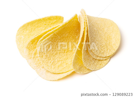 Round corn tortilla chips isolated on white studio background Round corn tortilla chips isolated on white studio background 129089223