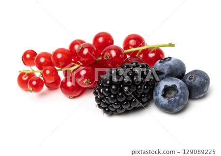 Organic ripe tasty organic berries red currant, blueberry and blackberry isolated on white studio background Organic ripe tasty organic berries red currant, blueberry and blackberry isolated on white studio background 129089225