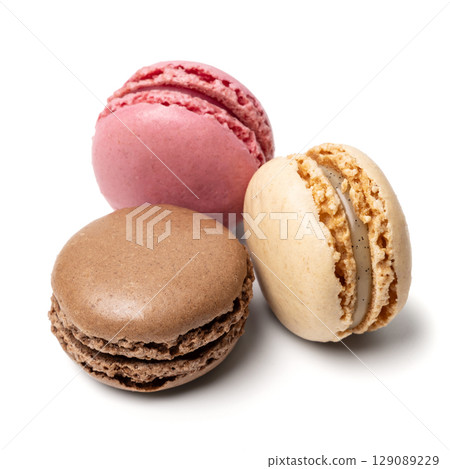 Small colorful tasty sweet original classic macaroons cakes isolated on white studio background Small colorful tasty sweet original classic macaroons cakes isolated on white studio background 129089229