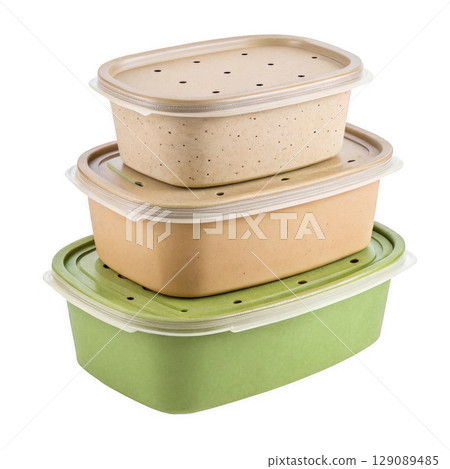 Biodegradable food containers stacked in three sizes, made from eco friendly materials, with perforated lids for ventilation 129089485