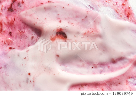 Creamy strawberry swirl texture with rich red and pink hues 129089749