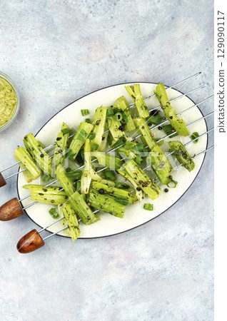 Green celery on skewers, veggie style. Green celery on skewers, veggie style. 129090117