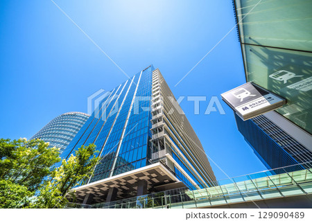 Yokohama cityscape in July. Overlooking the business district in front of Shin-Takashima Station. Yokohama cityscape in July. Overlooking the business district in front of Shin-Takashima Station. 129090489
