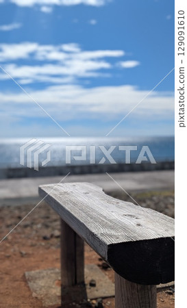 A bench to feel the sea breeze: A summer afternoon moment 129091610